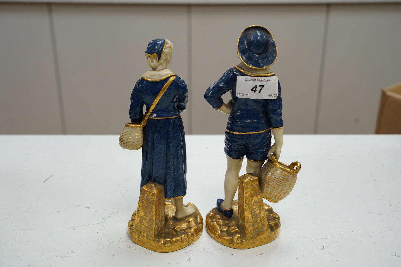 A pair of Worcester figures, fisherfolk, model number 1202, 21cm. Condition - good, some minor wear to gilding